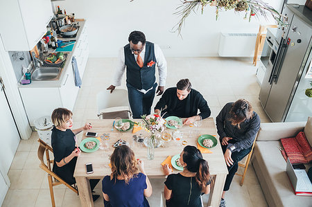 simsearch:614-08392689,k - Businessmen and businesswomen celebrating at lunch party in loft office Stock Photo - Premium Royalty-Free, Code: 649-09251142