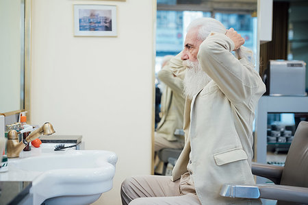 simsearch:649-09251527,k - Senior businessman tying hair in salon Stock Photo - Premium Royalty-Free, Code: 649-09251535