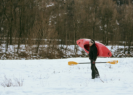 Male kayaker carrying kayak over his shoulder in snow, Domodossola, Piemonte, Italy Stock Photo - Premium Royalty-Free, Code: 649-09251793