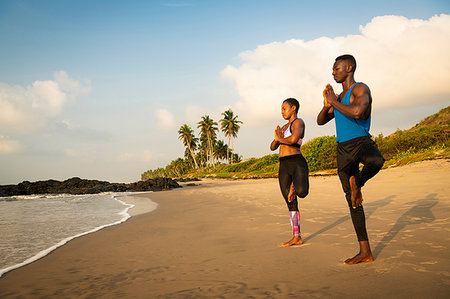 simsearch:614-07444019,k - Couple practising yoga on beach Stock Photo - Premium Royalty-Free, Code: 649-09251948