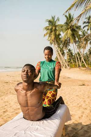 Woman massaging man on beach Stock Photo - Premium Royalty-Free, Code: 649-09251976