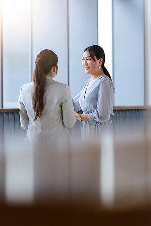 Businesswomen talking in office Stock Photo - Premium Royalty-Free, Code: 649-09252141