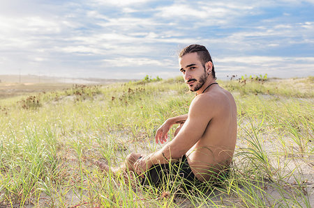 Man relaxing on field, Fortaleza, Ceara, Brazil Stock Photo - Premium Royalty-Free, Code: 649-09252168