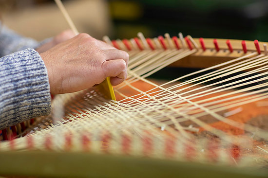 Young female basket maker weaving in workshop, close up of hands Stock Photo - Premium Royalty-Free, Image code: 649-09269174