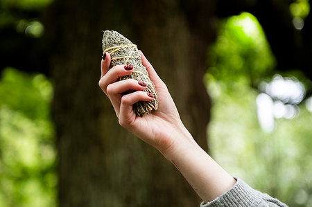 Woman holding healing stone for Reiki Stock Photo - Premium Royalty-Free, Code: 649-09269293