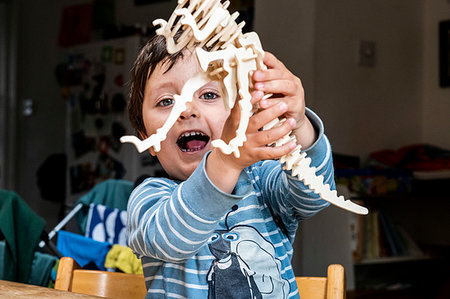 simsearch:649-09269303,k - Boy playing with wooden dinosaur Stock Photo - Premium Royalty-Free, Code: 649-09269301