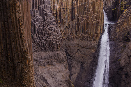 Detail of rock formation and waterfall, Hofn, Austur-Skaftafellssysla, Iceland Stock Photo - Premium Royalty-Free, Code: 649-09275696