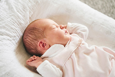 simsearch:6118-07441012,k - Baby sleeping on U-shaped pillow at home Stock Photo - Premium Royalty-Free, Code: 649-09275864