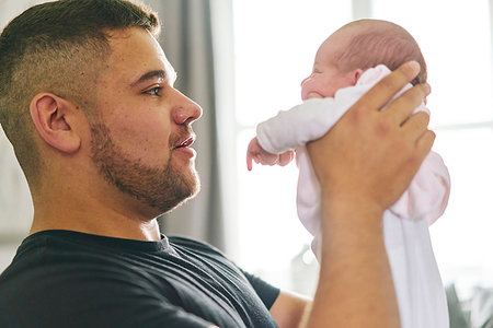 simsearch:614-09211363,k - Father bonding with baby in arms at home Stock Photo - Premium Royalty-Free, Code: 649-09275883