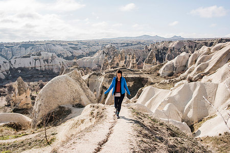 simsearch:649-09111386,k - Woman hiking in rocky valley, Göreme, Cappadocia, Nevsehir, Turkey Stock Photo - Premium Royalty-Free, Code: 649-09276033