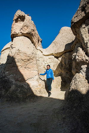 simsearch:649-08902087,k - Woman exploring cave, Göreme, Cappadocia, Nevsehir, Turkey Stock Photo - Premium Royalty-Free, Code: 649-09276060