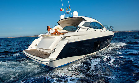 simsearch:6113-06898777,k - Woman relaxing on yacht Stock Photo - Premium Royalty-Free, Code: 649-09277363