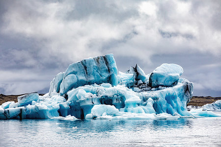 simsearch:649-08085944,k - Icebergs floating in glacier lagoon, Jokulsarlon Lagoon, Iceland Foto de stock - Sin royalties Premium, Código: 649-09277512