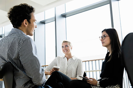 simsearch:632-03754699,k - Businessman and businesswomen at meeting in office Photographie de stock - Premium Libres de Droits, Code: 649-09277635