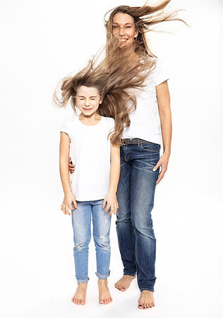 simsearch:6102-06336642,k - Mother and daughter with flying hair, white background Foto de stock - Sin royalties Premium, Código: 649-09277739