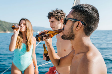 simsearch:649-09278006,k - Friends enjoying beer on sailboat, Italy Stock Photo - Premium Royalty-Free, Code: 649-09278039