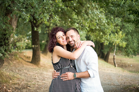 simsearch:6118-08991581,k - Couple hugging in park Stock Photo - Premium Royalty-Free, Code: 649-09278449