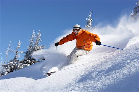 Austria, Saalbach, man skiing down slope Foto de stock - Royalty Free Premium, Número: 649-01556006