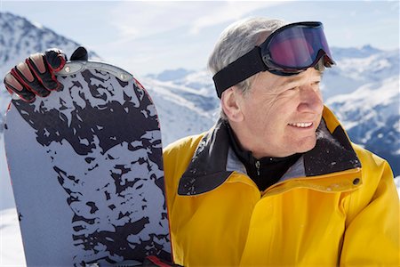 Mature male snowboarder on mountain, close-up, portrait Stock Photo - Premium Royalty-Free, Code: 649-01556022