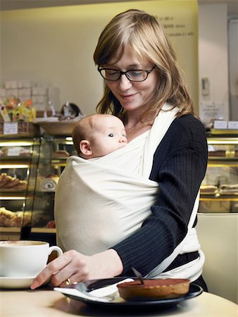 Mother holding baby son (2-4 months) in cafe Stock Photo - Premium Royalty-Free, Code: 649-01557432