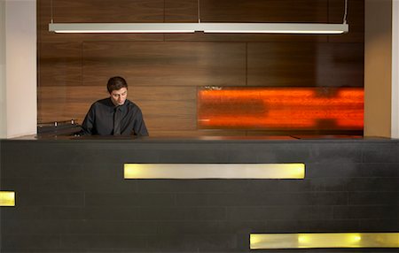 reception counter - Staff at reception in hotel lobby Stock Photo - Premium Royalty-Free, Code: 649-01608275