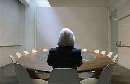 executives on table back - Woman seated in boardroom from behind Stock Photo - Premium Royalty-Free, Code: 649-01608311