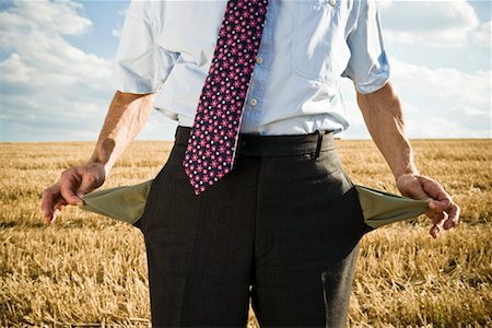 proof - Turned-out pockets in wheat field. Stock Photo - Premium Royalty-Free, Code: 649-01608598