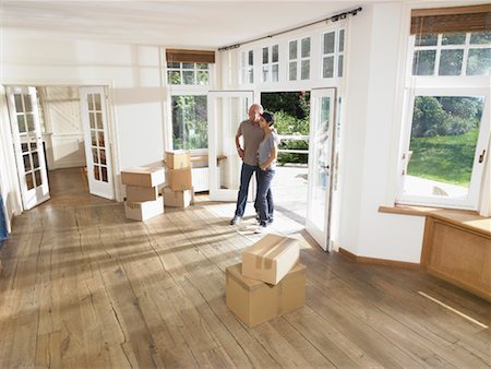 empty box inside - Couple moving boxes into new house. Stock Photo - Premium Royalty-Free, Code: 649-01608751