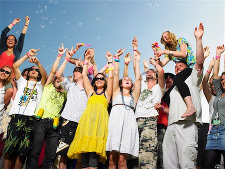 sitting on shoulder not child - Crowd of young people cheering and waving Stock Photo - Premium Royalty-Free, Code: 649-01609590