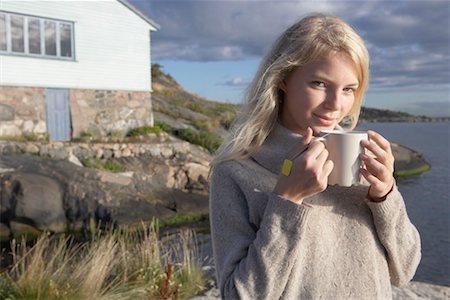 Young Woman relaxing on jetty. Stock Photo - Premium Royalty-Free, Code: 649-01754608