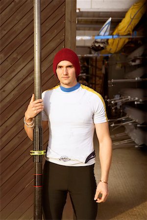 single man rowing - Oarsman outside boat shed. Stock Photo - Premium Royalty-Free, Code: 649-01754892