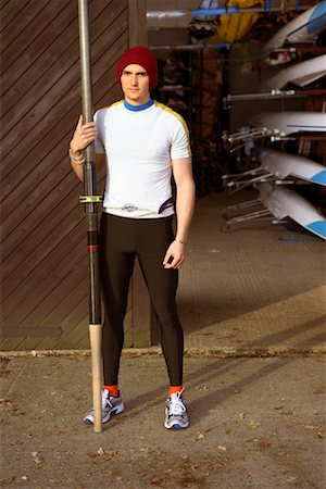 single man rowing - Oarsman outside boat shed. Stock Photo - Premium Royalty-Free, Code: 649-01754893