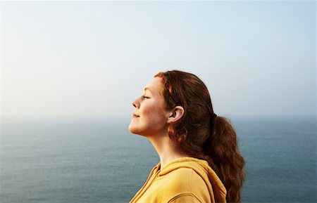 Profile of a young Woman by the sea. Stock Photo - Premium Royalty-Free, Code: 649-01755307