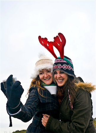 friends christmas - Girls taking self photo Stock Photo - Premium Royalty-Free, Code: 649-02054095