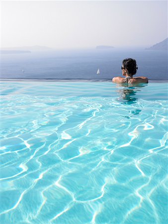 edge of pool person back - Woman in swimming pool Stock Photo - Premium Royalty-Free, Code: 649-02054254