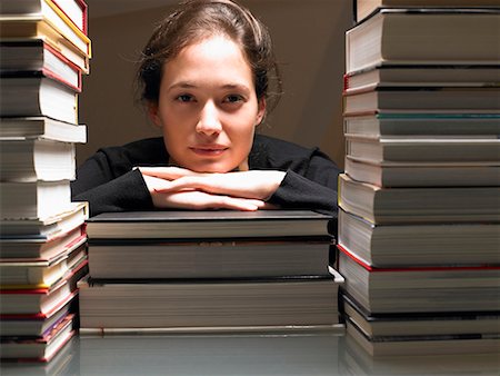 stack of text books - Woman resting on books Stock Photo - Premium Royalty-Free, Code: 649-02054410