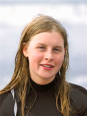 simsearch:649-02054536,k - Portrait of female surfer with wet hair Stock Photo - Premium Royalty-Free, Code: 649-02054532