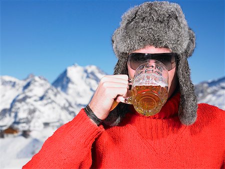 ski fashion - Young man having drink at mountains Stock Photo - Premium Royalty-Free, Code: 649-02054919