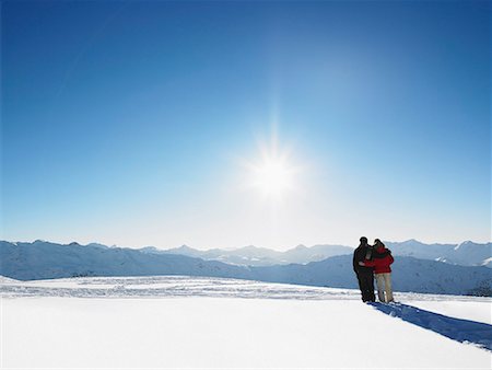 Couple walking in snow on mountain top Stock Photo - Premium Royalty-Free, Code: 649-02054977