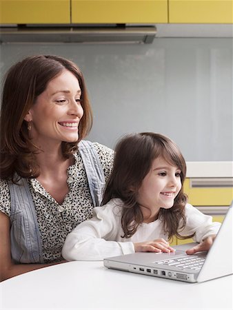 Mother and young girl using laptop Stock Photo - Premium Royalty-Free, Code: 649-02055096