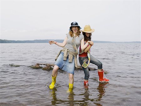 friends dance - Two women standing in shallow water Stock Photo - Premium Royalty-Free, Code: 649-02055246