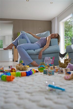 family living room not kids - Young mother sleeping on chair Stock Photo - Premium Royalty-Free, Code: 649-02198775