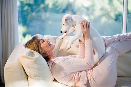 simsearch:649-02198842,k - Woman Relaxing, Playing With Dog Stock Photo - Premium Royalty-Free, Code: 649-02198842