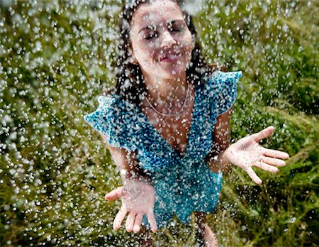 rain drop female - Woman standing in rain Stock Photo - Premium Royalty-Free, Code: 649-02198896