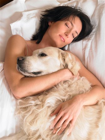 dog woman exhausted - Woman with dog laying Stock Photo - Premium Royalty-Free, Code: 649-02198934