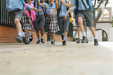 pictures of kids and friends playing at school - School children running low angle Stock Photo - Premium Royalty-Free, Code: 649-02199299