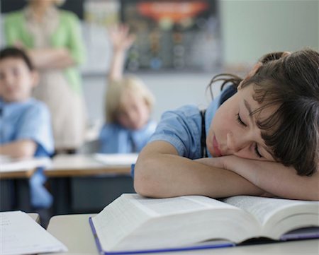 School girl sleeping at desk Stock Photo - Premium Royalty-Free, Code: 649-02199329