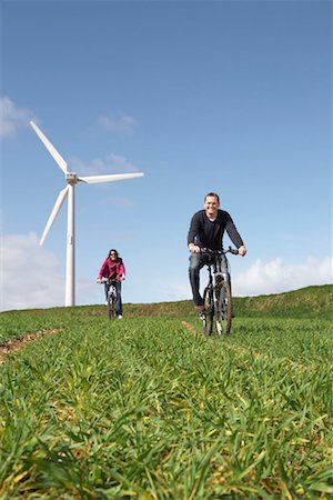 sustainable future - Couple riding bikes Stock Photo - Premium Royalty-Free, Code: 649-02199581