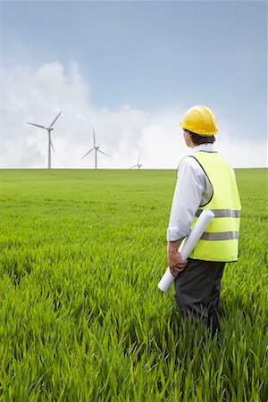 Man holding plans on a wind farm Stock Photo - Premium Royalty-Free, Code: 649-02199598