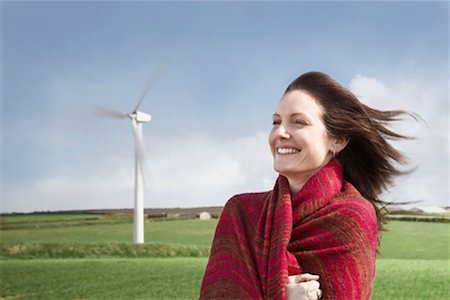 Woman with hair blowing on a wind farm Stock Photo - Premium Royalty-Free, Code: 649-02199591